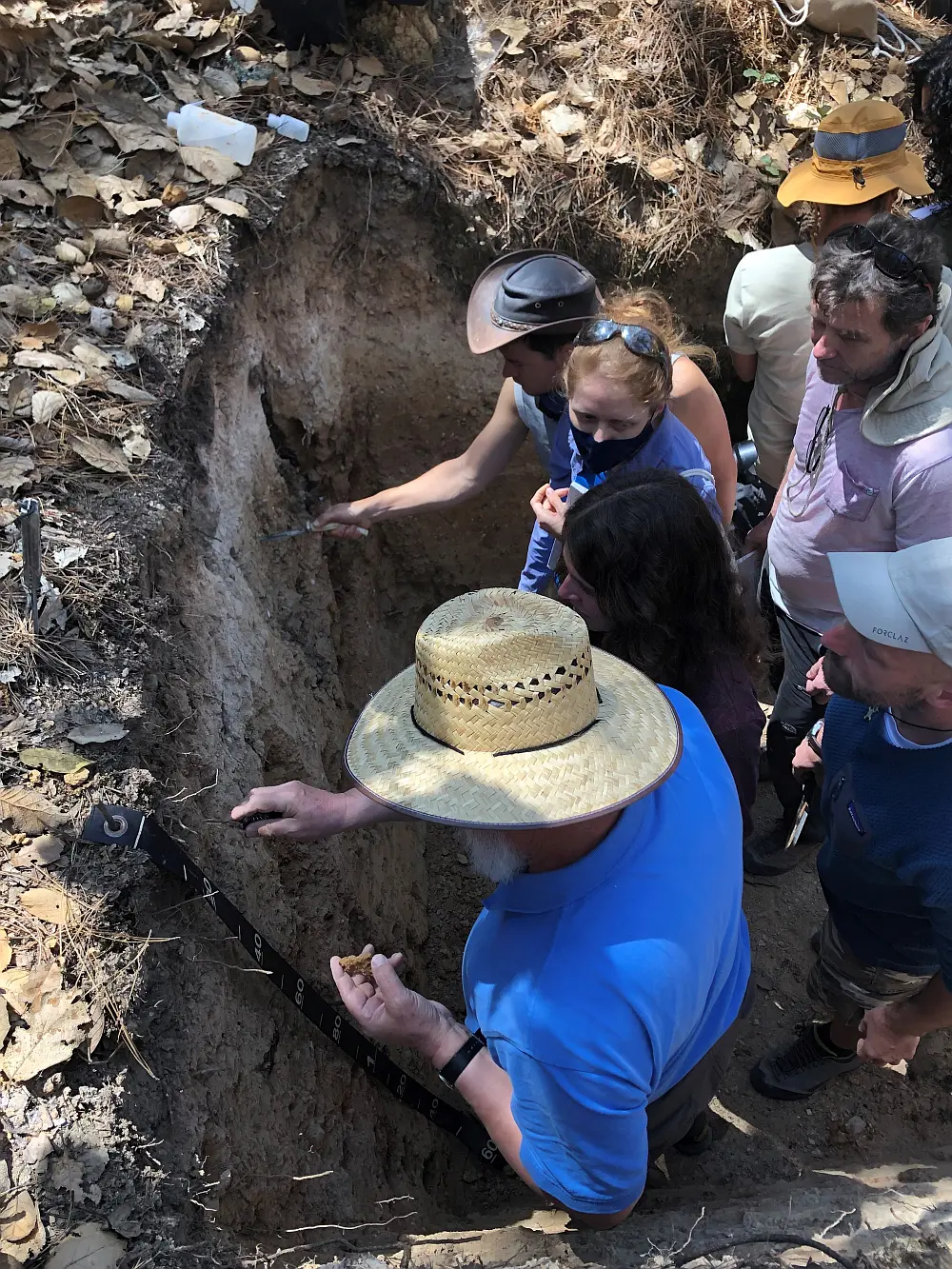 "Figure 2: Members of the WRB group studying a soil profile in Mexico (2022). "