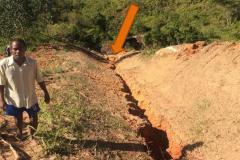 Gullly "bulldozered" by large rock (at the bottom, see arrow) during recent heavy rainstorm