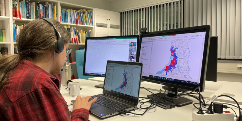 A member of the HazArctic team at GTK creating a map of acid sulfate soil occurrences in the study area in Finland using online guidance by ISRIC. Credit: Anton Boman 